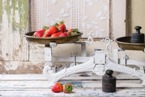 Weights and scales with strawberries